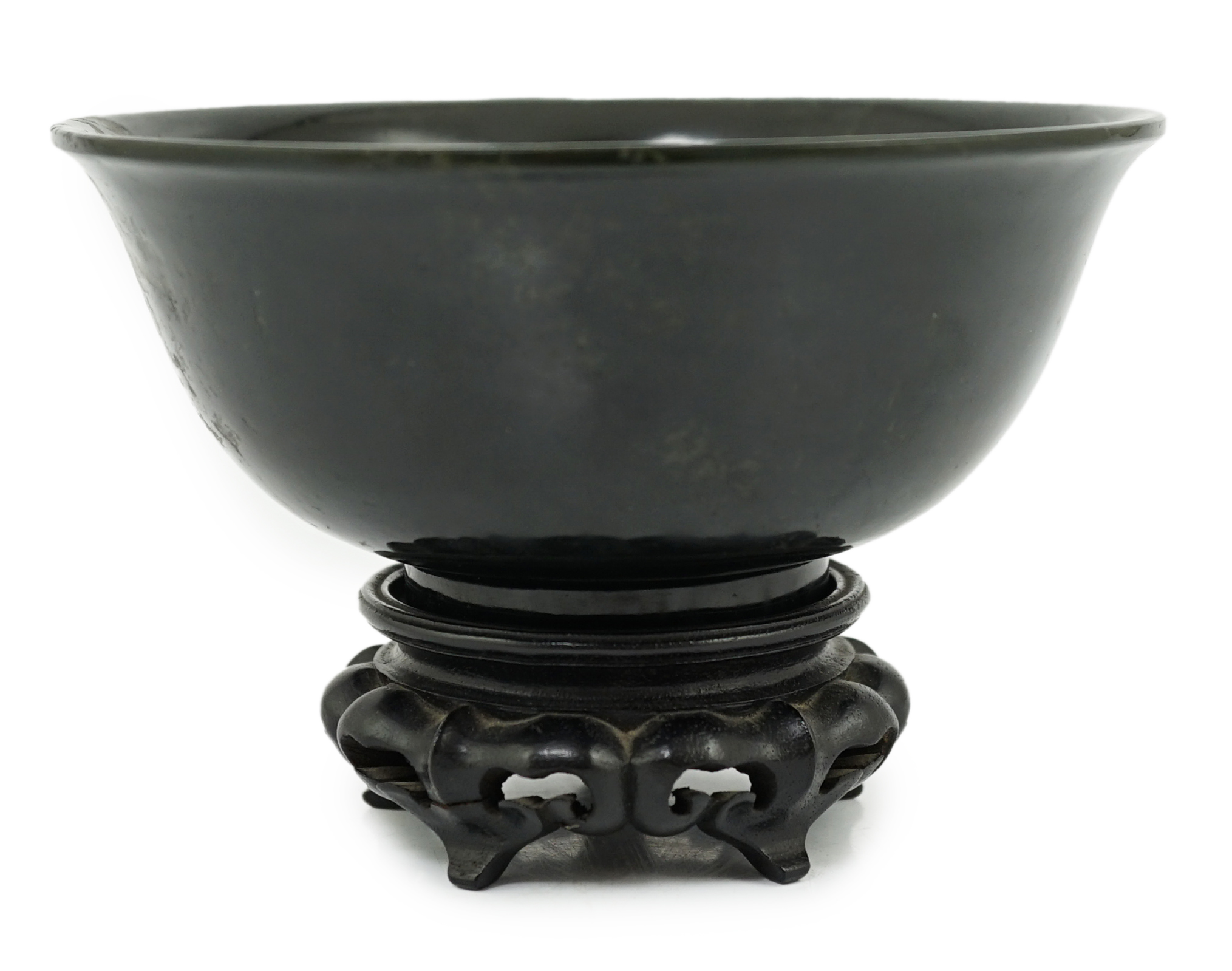 A Chinese dark spinach green jade bowl, engraved Qianlong seal mark but 19th/20th century